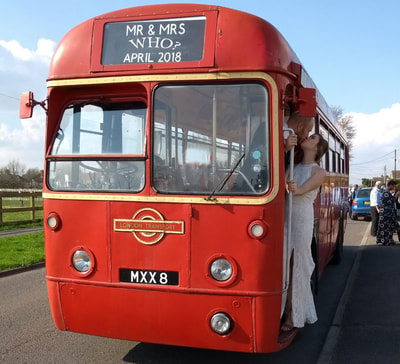 Pretty as a picture, our bride today encourages her new husband off the wedding bus. This bus was born before her parents!
