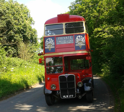 Our 1947 double decker on the road in its delivery guise. It was extensively renovated for period looks but is thoroughly usable in this presentation for weddings or corporate jollies.